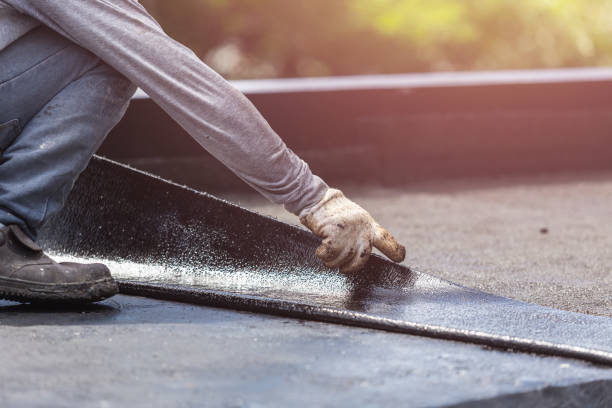 Professional Waterproofing technician working in Holland, NY